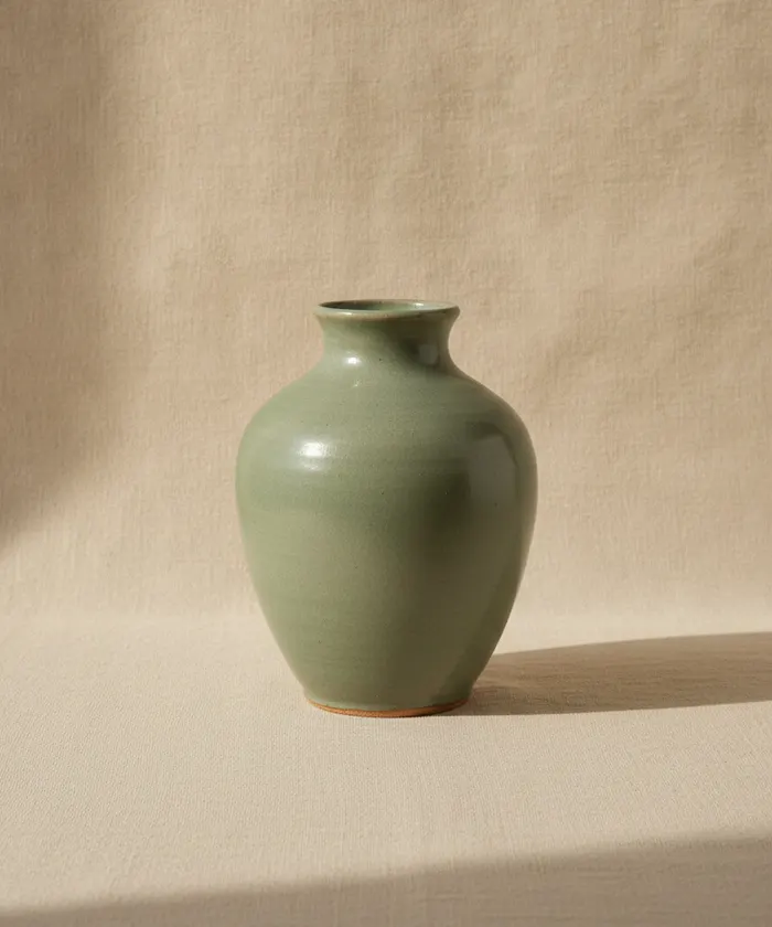 A celadon-glazed vase, one of Clay Studio’s own stills